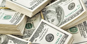 Many  bundle of US 100 dollars bank notes