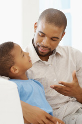 Father disciplining son